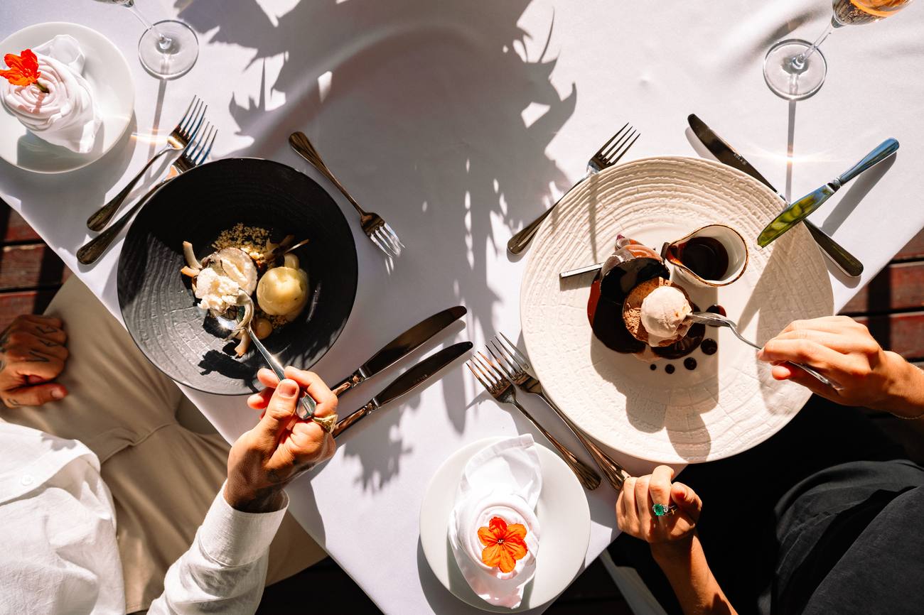Overhead of a couple sharing dessert
